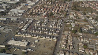 DCSF08_004 - Aerial stock footage of 5K Aerial Video Reverse view of tract homes, reveal office buildings, Hayward, California