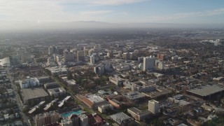 DCSF09_004 - Aerial stock footage of 5K Aerial Video Flyby San Jose State University, Downtown San Jose in the background, California