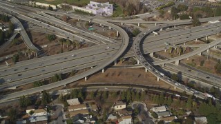 DCSF09_007 - Aerial stock footage of 5K Aerial Video Flying over freeway interchange, tilt to reveal Downtown San Jose, California