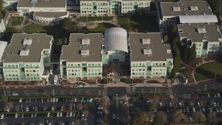 DCSF09_016 - Aerial stock footage of 5K Aerial Video Fly over parking lots and reveal Apple Headquarters, tilt to bird's eye view, Cupertino, California