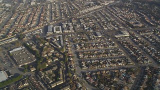 DCSF09_035 - Aerial stock footage of 5K Aerial Video Reverse view of residential neighborhoods and shopping centers, San Leandro, California
