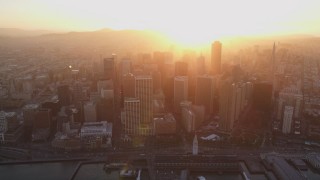 DCSF10_009 - Aerial stock footage of 5K Aerial Video Downtown skyscrapers and the Ferry Building, San Francisco, California, sunset