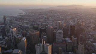 DCSF10_011 - Aerial stock footage of 5K Aerial Video Tilt from city streets and fly over Financial District toward South of Market, San Francisco, California, twilight