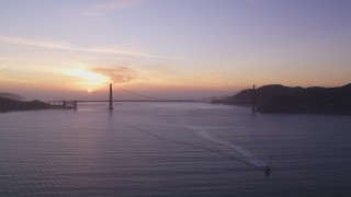 DCSF10_025 - Aerial stock footage of 5K Aerial Video Setting sun behind the Golden Gate Bridge, San Francisco, California, sunset