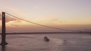 DCSF10_042 - Aerial stock footage of 5K Aerial Video View of an oil tanker approaching the Golden Gate Bridge, San Francisco, California, twilight