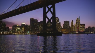 DCSF10_066 - Aerial stock footage of 5K Aerial Video Fly under Bay Bridge near Downtown San Francisco, California, twilight