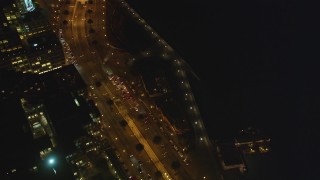 DCSF10_076 - Aerial stock footage of 5K Aerial Video Fly by The Embarcadero and tilt up, Downtown San Francisco, California, night