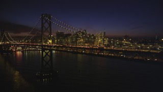 DCSF10_080 - Aerial stock footage of 5K Aerial Video of The Bay Bridge and Downtown San Francisco skyline, California, night