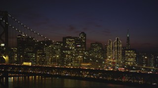 DCSF10_083 - Aerial stock footage of 5K Aerial Video of Downtown San Francisco skyline seen while passing by the Bay Bridge, California, night