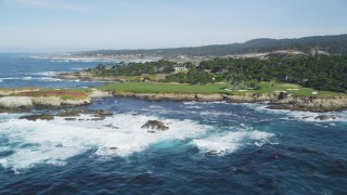 DCSF11_006 - Aerial stock footage of 5K Aerial Video Ocean waves rolling toward Cypress Point Golf Course, Pebble Beach, California