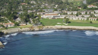 DCSF11_007 - Aerial stock footage of 5K Aerial Video Tilt from the ocean to reveal Pebble Beach Golf Links and Pebble Beach Resorts, California