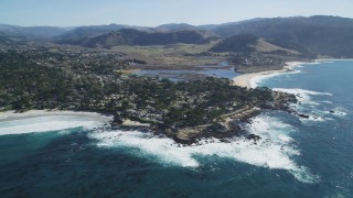 DCSF11_009 - Aerial stock footage of 5K Aerial Video Tilt from the ocean to reveal a coastal residential neighborhood in Carmel, California