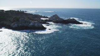 DCSF11_013 - Aerial stock footage of 5K Aerial Video Tilt to reveal waves crashing into coastal rock formations, Carmel, California