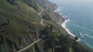 DCSF11_034 - Aerial stock footage of 5K Aerial Video Tilt up Highway 1 with light traffic above coastal cliffs, Big Sur, California