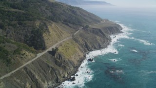 DCSF11_039 - Aerial stock footage of 5K Aerial Video Highway 1 with light traffic and coastal cliffs, Big Sur, California