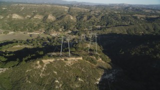 DCSF12_003 - Aerial stock footage of 5K Aerial Video Following a row of power lines over hills, San Luis Obispo County, California