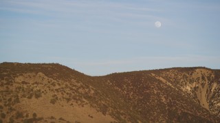 DCSF12_013 - Aerial stock footage of 5K Aerial Video Flying by the a ridge in the Temblor Range with the moon overhead, San Luis Obispo County, California