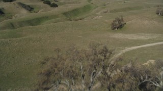 DFKSF01_008 - 5K aerial stock footage of approaching and flying over an isolated ranch house and a barn, Simi Valley, California