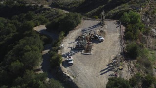 DFKSF01_017 - 5K aerial stock footage of orbiting oil rigs on a hilltop, Santa Paula, California