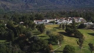 DFKSF01_026 - 5K aerial stock footage of a wider view of the Ojai Valley Inn and Spa hotel, Ojai, California