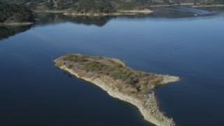 DFKSF01_031 - 5K aerial stock footage of flying over a small peninsula in Lake Casitas, California