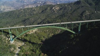 DFKSF01_049 - 5K aerial stock footage of flying by the Cold Springs Canyon Arch Bridge, Santa Ynez Mountains, California