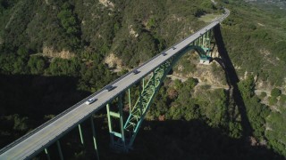 DFKSF01_051 - 5K aerial stock footage of an orbit of the Cold Springs Canyon Arch Bridge, Santa Ynez Mountains, California