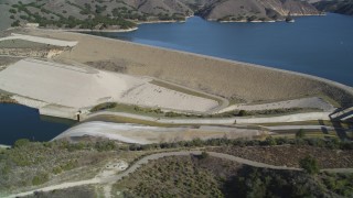 DFKSF01_060 - 5K aerial stock footage of flying by Lake Cachuma, revealing Bradbury Dam; Lake Cachuma, California
