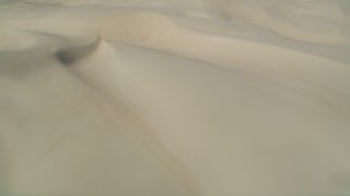 DFKSF02_025 - 5K aerial stock footage of passing by the sand dunes, Pismo Dunes, California