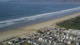 DFKSF02_032 - 5K aerial stock footage of approaching beachfront homes and Pismo State Beach, Oceano, California