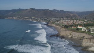 DFKSF02_045 - 5K aerial stock footage fly over waves rolling toward coastal community of Shell Beach, California