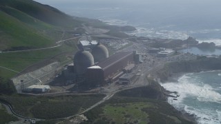 DFKSF02_075 - 5K aerial stock footage of orbiting the coastal Diablo Canyon Power Plant, Avila Beach, California