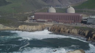 DFKSF02_081 - 5K aerial stock footage of flying by the Diablo Canyon Power Plant nuclear facility, Avila Beach, California