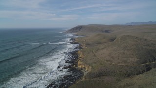 DFKSF03_022 - 5K aerial stock footage of following the rugged coastline, Harmony, California