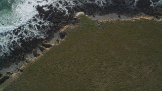 DFKSF03_039 - 5K aerial stock footage of a bird's eye view of the rocky coastline and coastal cliffs, Cambria, California