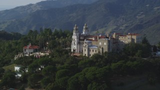 DFKSF03_064 - 5K aerial stock footage of flying by the east side of iconic Hearst Castle, San Simeon, California