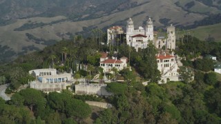 DFKSF03_069 - 5K stock footage aerial video of flying away from Hearst Castle, San Simeon, California