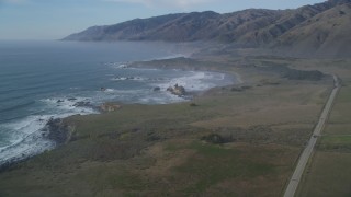 DFKSF03_075 - 5K aerial stock footage approach the coastline from over Highway 1, San Simeon, California