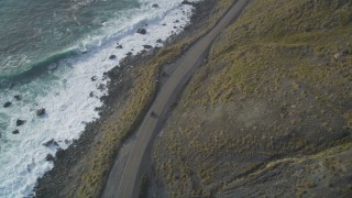DFKSF03_091 - 5K aerial stock footage of tracking a car traveling on Highway 1 along the coast, Big Sur, California