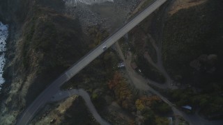 DFKSF03_113 - 5K stock footage aerial video of tracking a white car on Highway 1 coastal road, Big Sur, California