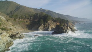 DFKSF03_116 - 5K aerial stock footage of approaching McWay Falls and coastal cliffs, Big Sur, California