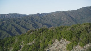 DFKSF03_137 - 5K aerial stock footage pan across green ridges in a mountain landscape, Los Padres National Forest, California