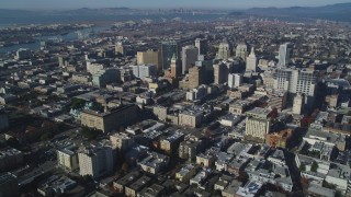 DFKSF05_003 - 5K stock footage aerial video pan across city buildings in Downtown Oakland, California
