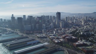 DFKSF05_022 - 5K aerial stock footage of reverse view of skyscrapers, reveal North Beach and Coit Tower, Downtown San Francisco, California