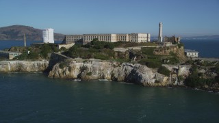 DFKSF05_024 - 5K aerial stock footage tilt from San Francisco Bay to revealing Alcatraz, San Francisco, California