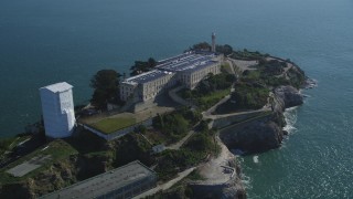 DFKSF05_026 - 5K aerial stock footage of a reverse view of the historic landmark, Alcatraz, in San Francisco, California