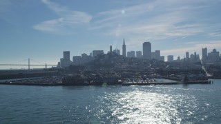 DFKSF05_073 - 5K stock footage aerial video approach iconic Pier 39, Coit Tower, views of skyline, Downtown San Francisco, California