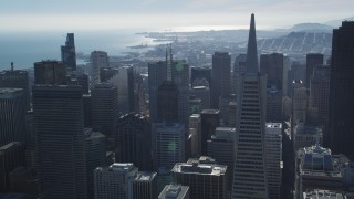 DFKSF05_076 - 5K aerial stock footage of approaching iconic Transamerica Pyramid and skyscrapers, Downtown San Francisco, California