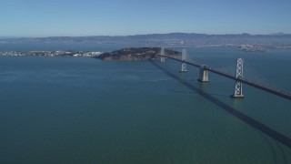 DFKSF05_086 - 5K aerial stock footage of a view of the Bay Bridge, Yerba Buena Island, Treasure Island in San Francisco, California