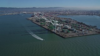 DFKSF05_092 - 5K aerial stock footage approach large cargo cranes at the Port of Oakland, California